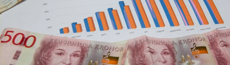 Papper med diagram och sedlar