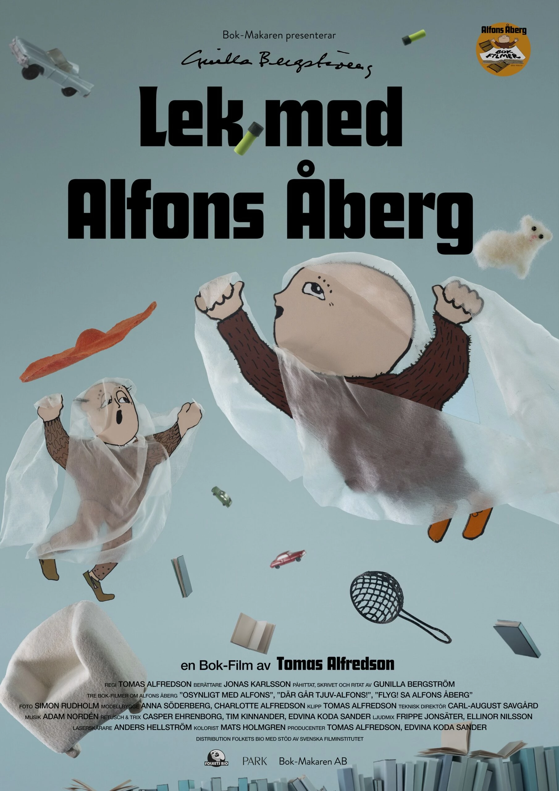Filmaffisch med Alfons Åberg och hans pappa. De flyger i luften tillsammans med leksaker